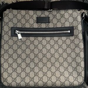 Men’s Gucci monogram messenger bag